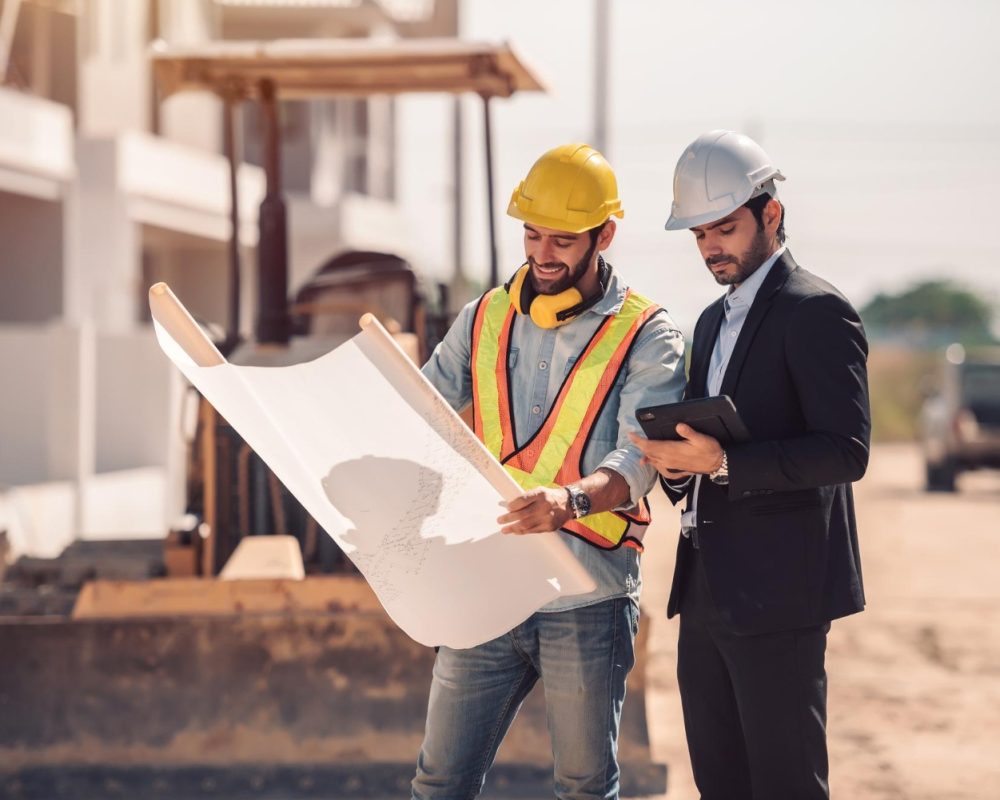 civil-engineer-construction-worker-manager-holding-digital-tablet-blueprints-talking-planing-about-construction-site-cooperation-teamwork-concept_11zon civil-engineer-construction-worker-manager-holding-digital-tablet-blueprints-talking-planing-about-construction-site-cooperation-teamwork-concept_11zon